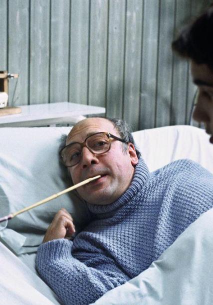 Javier Bardem in bed, with a paintbrush in his mouth